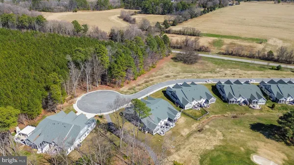 a view of a swimming pool with a yard