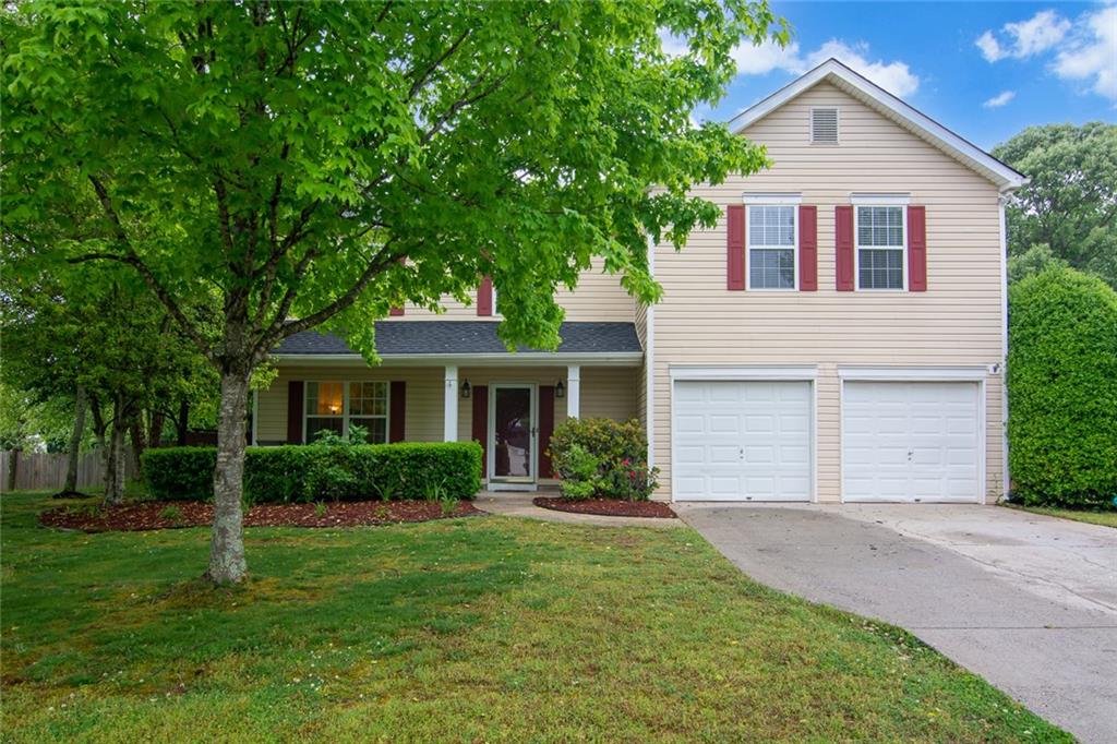4290 Ridgebrook Bend Cumming, GA 30028 - Photo 1 of 1 a front view of house with yard and green space