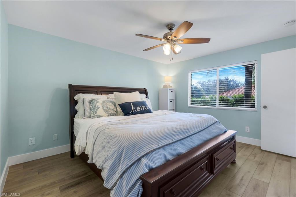 7767 Jewel Lane, Unit 203 Naples, FL 34109 - Photo 12 of 29 a bedroom with a bed and window