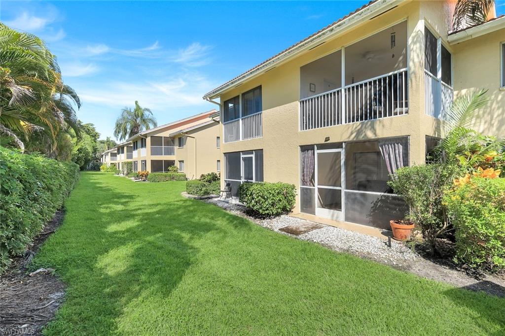 7767 Jewel Lane, Unit 203 Naples, FL 34109 - Photo 19 of 29 a house view with a garden space
