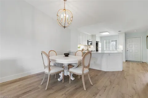 a view of workspace with wooden floor and window