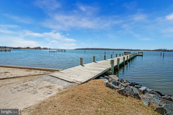 a view of a terrace with wooden floor and lake view