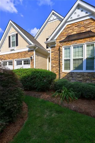 a view of a hallway with windows and stairs