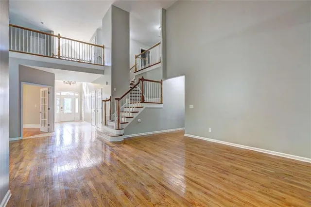 a view of a kitchen with a sink and refrigerator
