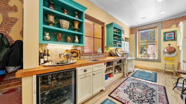 a kitchen with stainless steel appliances granite countertop a stove and a sink