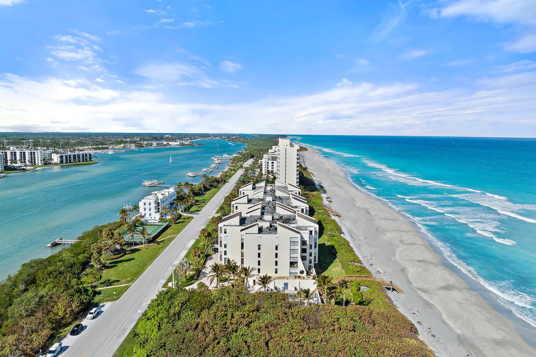 19670 South Beach Road, Unit B303 Jupiter, FL 33469 - Photo 77 of 104 a view of a lake with a city