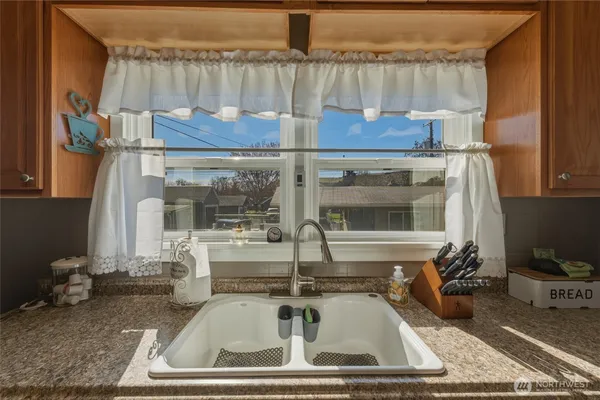 a kitchen with a sink and a window
