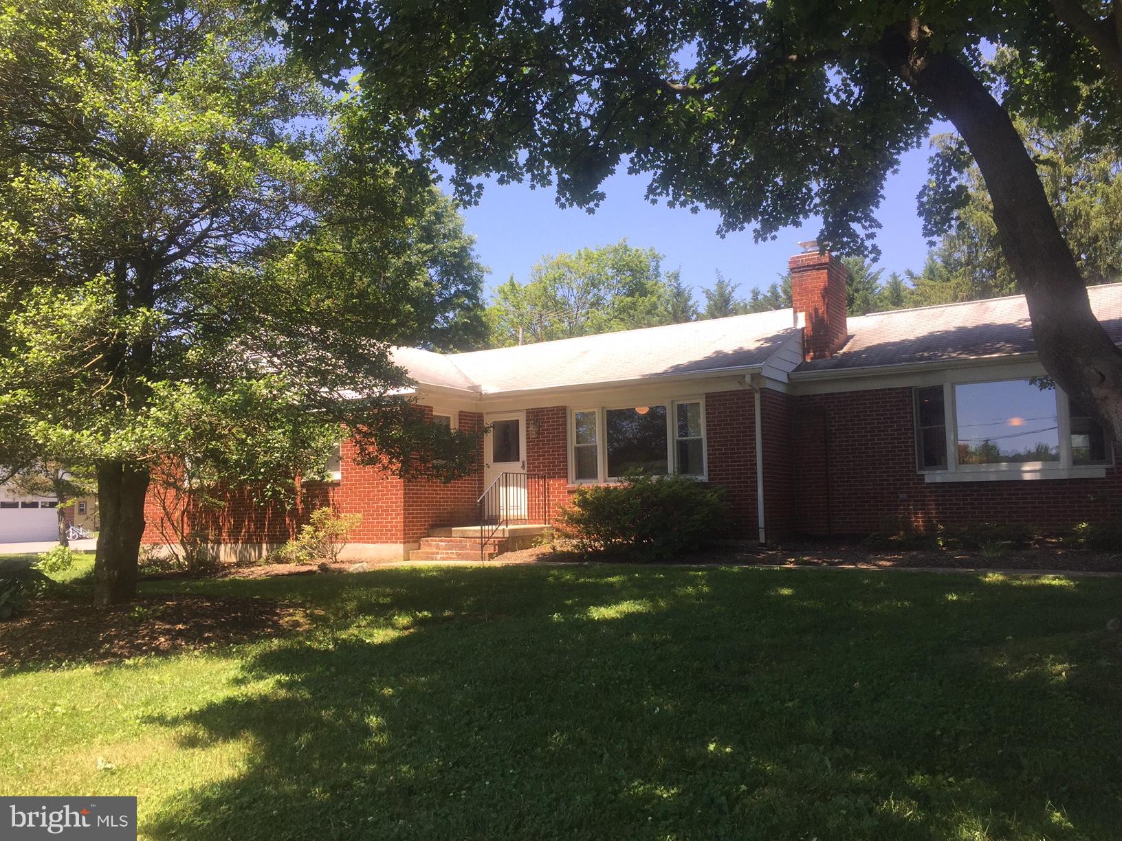 1210 Belfast Road Sparks, MD 21152 - Photo 1 of 29 a front view of a house with a yard