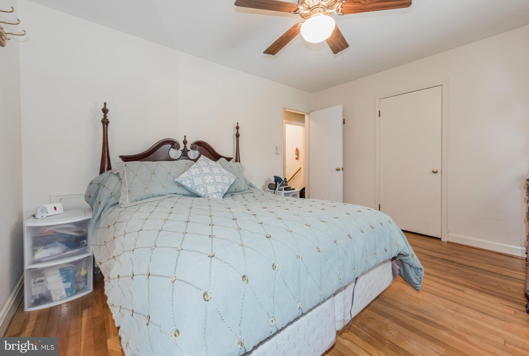 1210 Belfast Road Sparks, MD 21152 - Photo 16 of 29 a bedroom with a bed and a chandelier