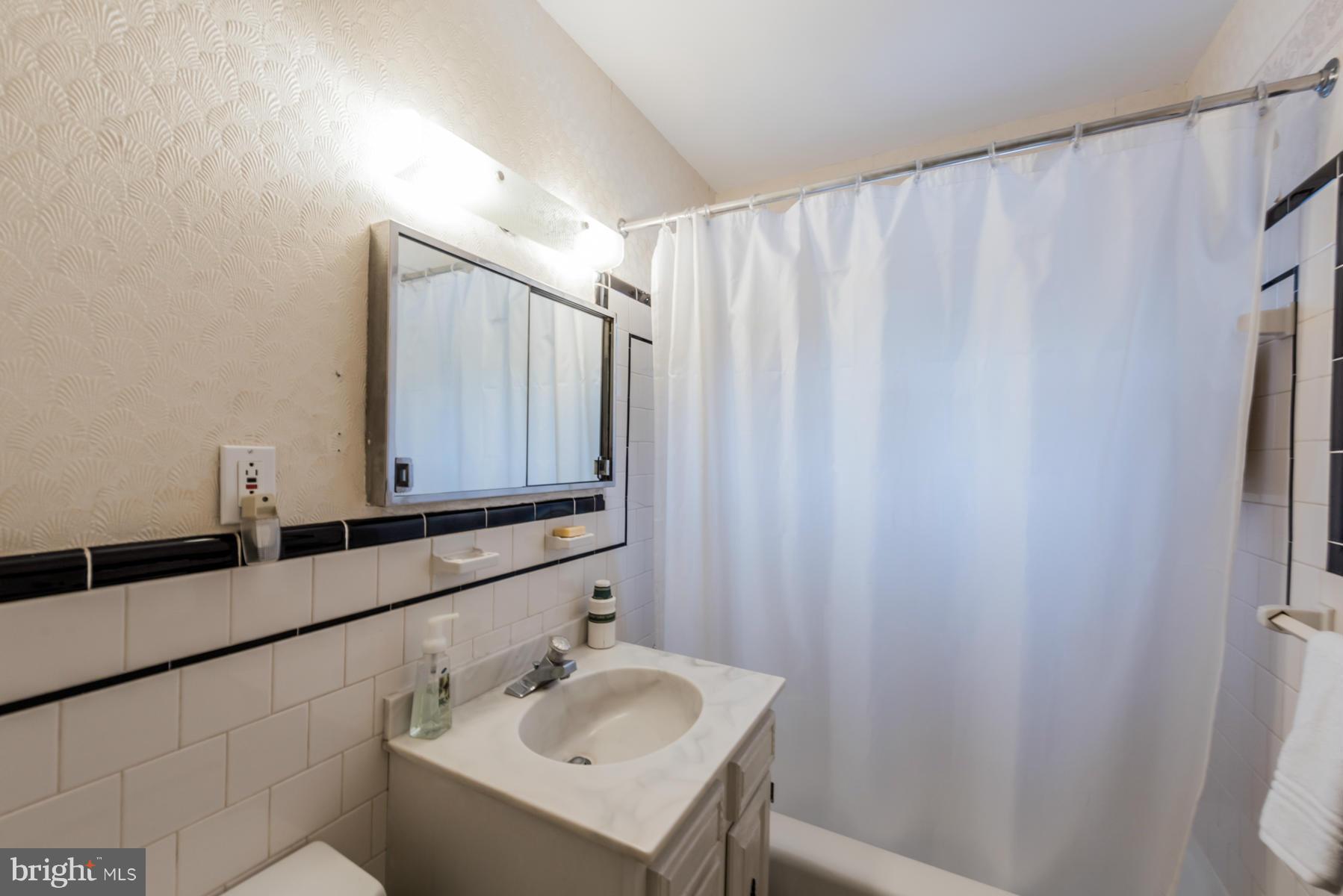 1210 Belfast Road Sparks, MD 21152 - Photo 21 of 29 a bathroom with a sink and a mirror