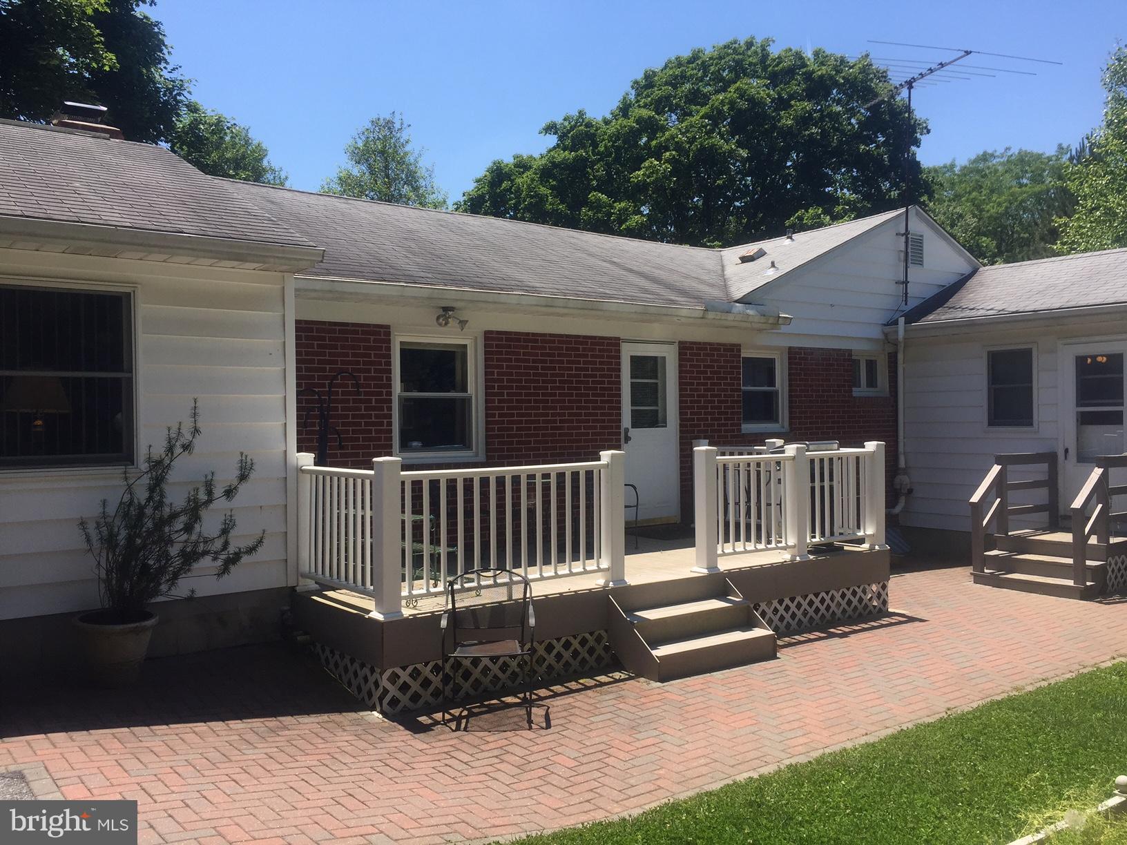 1210 Belfast Road Sparks, MD 21152 - Photo 27 of 29 a view of a deck with a couches chairs and wooden fence