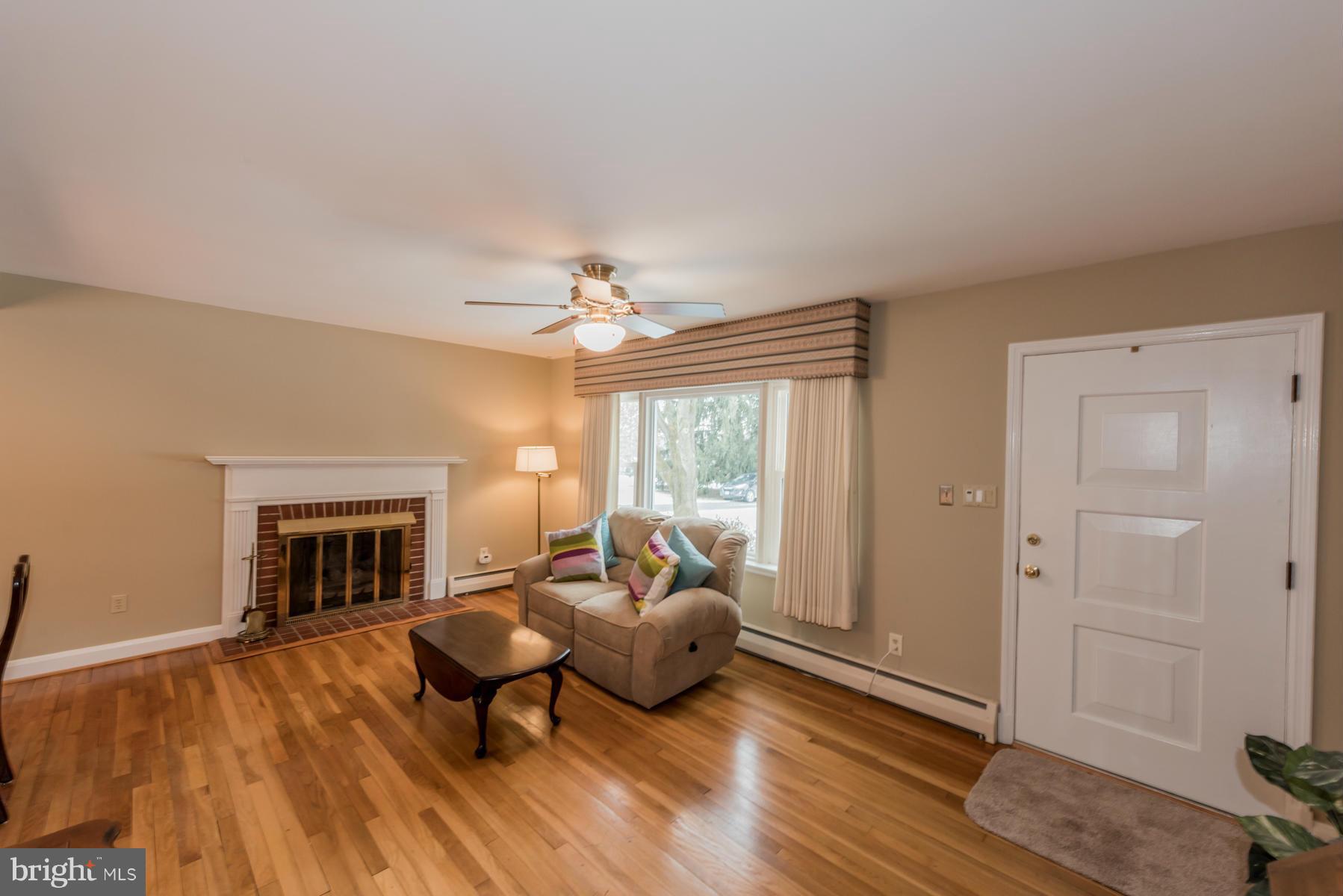 1210 Belfast Road Sparks, MD 21152 - Photo 3 of 29 a living room with furniture and a fireplace