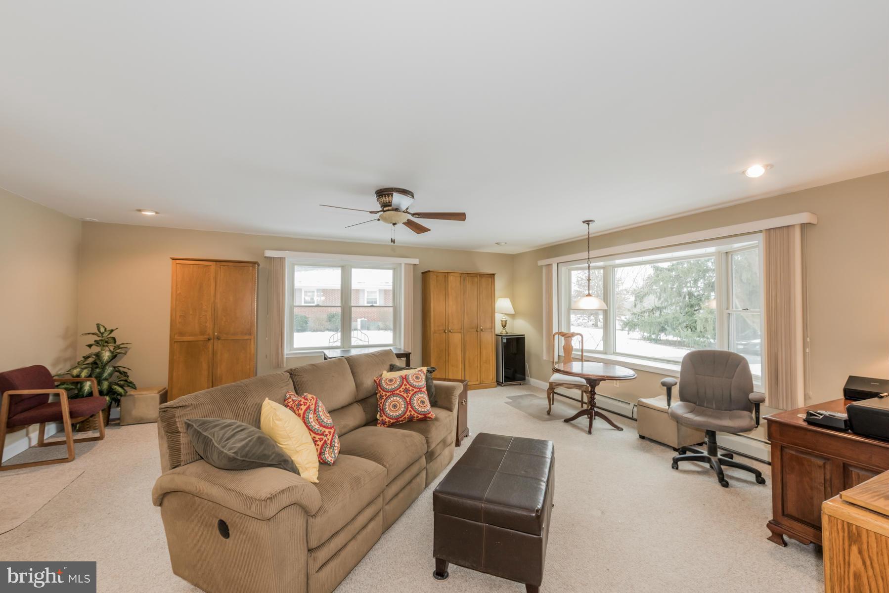 1210 Belfast Road Sparks, MD 21152 - Photo 7 of 29 a living room with furniture a large window and a flat screen tv