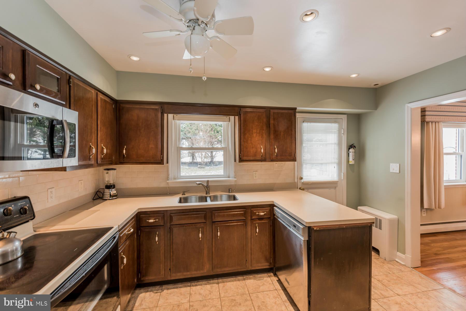 1210 Belfast Road Sparks, MD 21152 - Photo 10 of 29 a kitchen with a sink stove and microwave