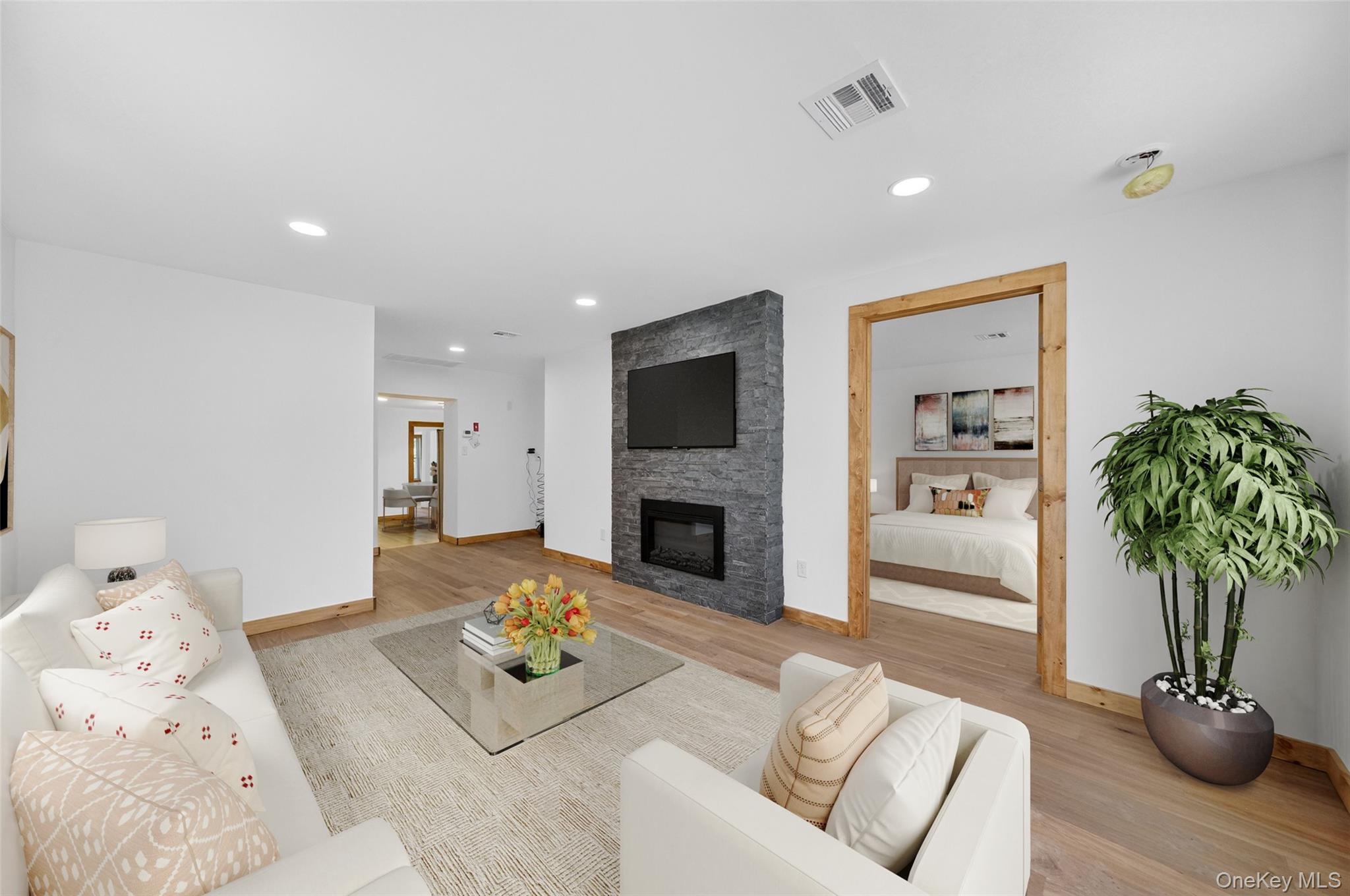 71 Blacks Road Kingston, NY 12401 - Photo 2 of 20 a living room with furniture potted plant and a fireplace