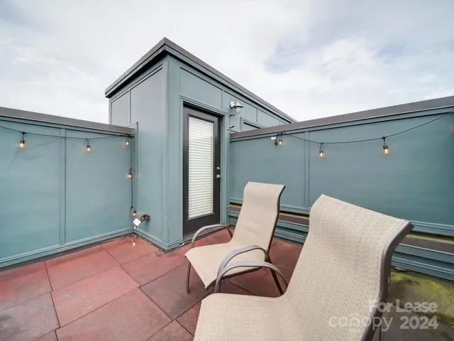 a backyard of a house with seating space