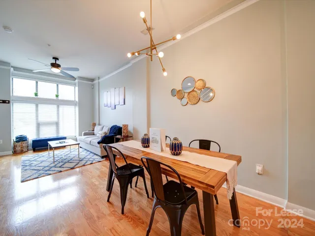 a view of a livingroom with furniture and a flat screen tv