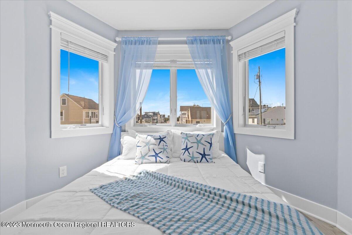 15 Dune Terrace, Unit 15B Seaside Heights, NJ 08751 - Photo 13 of 22 a bedroom with a bed and a window