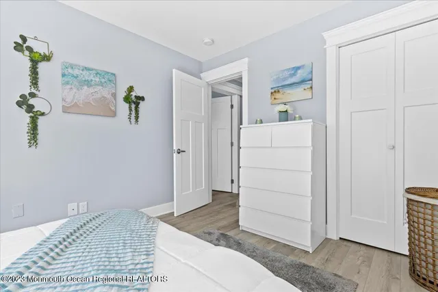 a view of a bedroom with furniture and cabinet