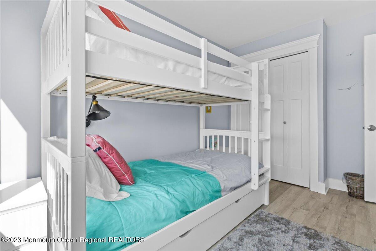 15 Dune Terrace, Unit 15B Seaside Heights, NJ 08751 - Photo 16 of 22 a bedroom with a bed and a window