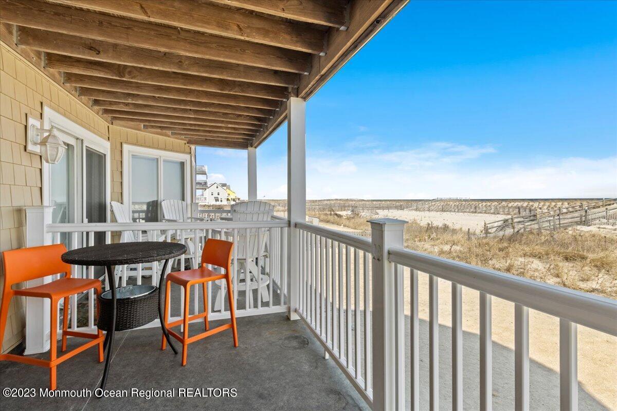 15 Dune Terrace, Unit 15B Seaside Heights, NJ 08751 - Photo 22 of 22 a balcony with furniture and city view