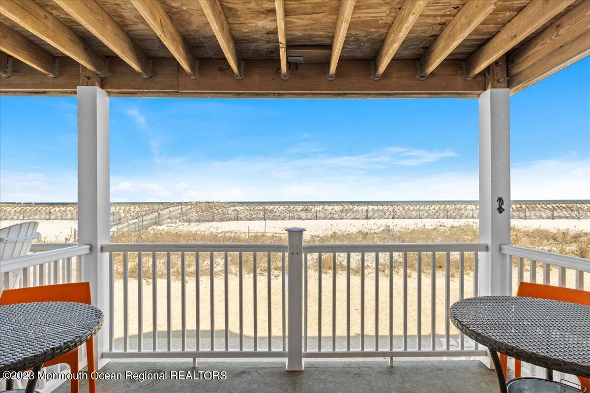 15 Dune Terrace, Unit 15B Seaside Heights, NJ 08751 - Photo 4 of 22 a view of a balcony with furniture and a window