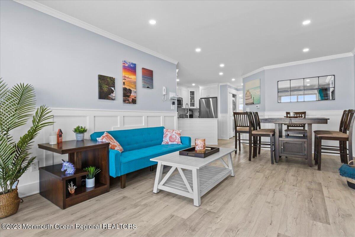 15 Dune Terrace, Unit 15B Seaside Heights, NJ 08751 - Photo 6 of 22 a living room with furniture and a wooden floor