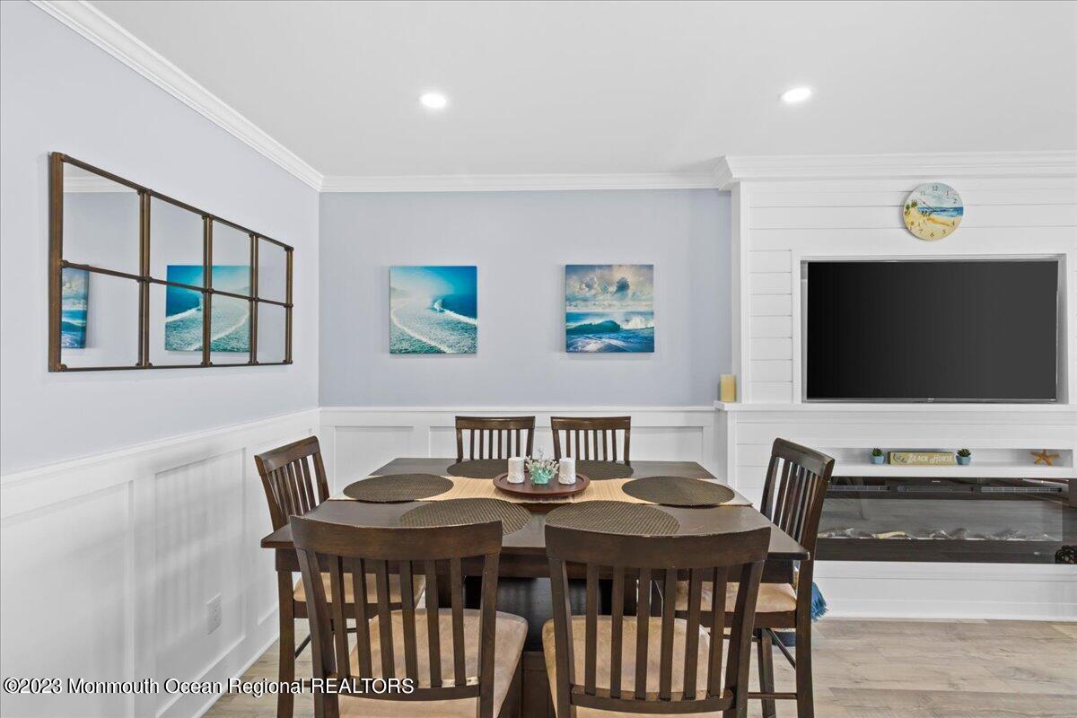 15 Dune Terrace, Unit 15B Seaside Heights, NJ 08751 - Photo 7 of 22 a view of a dining room with furniture and a flat screen tv