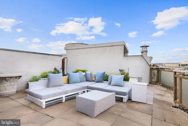 a outdoor space with patio furniture and a fireplace