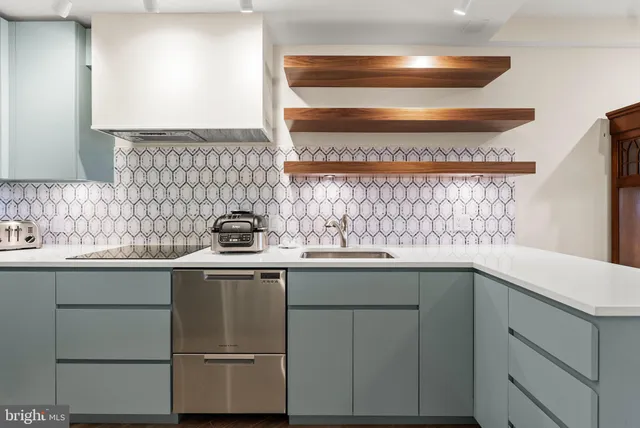 a kitchen with a sink and cabinets