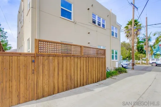 a view of a car park in front of house