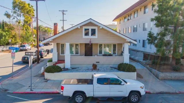 a front view of a house with parking space