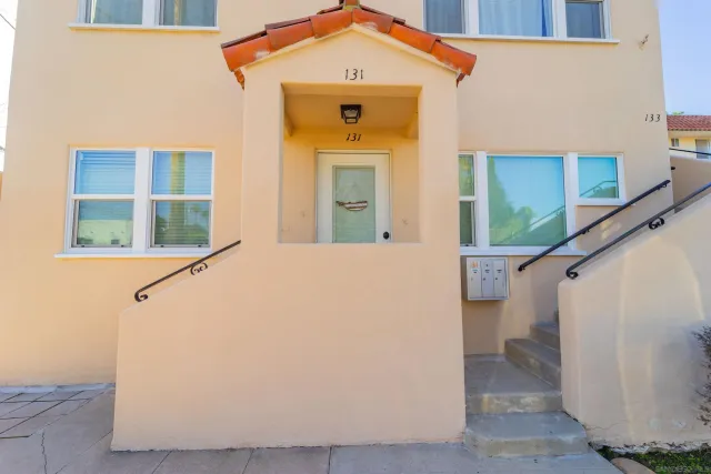 a view of a house with entryway and stairs