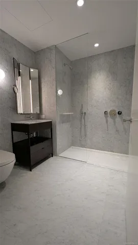 a bathroom with a bathtub and a double vanity sink