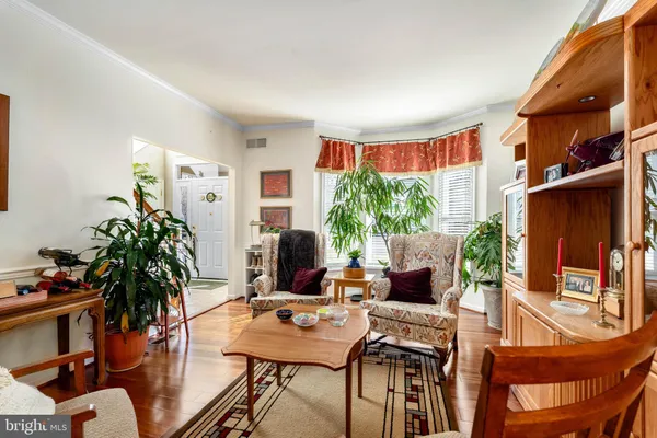 a view of a livingroom with furniture and a potted plant