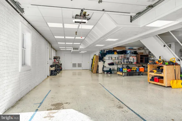 a view of balcony with furniture and wooden floor