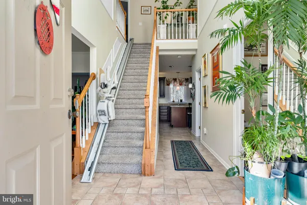 a view of entryway with flower pots