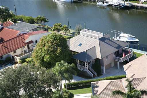 an aerial view of a house with a lake view