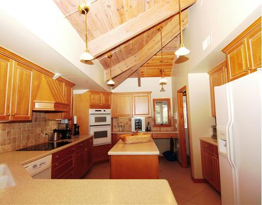 Undisclosed Address Stuart, FL 34997 - Photo 4 of 10 a open kitchen with stainless steel appliances granite countertop a refrigerator a stove and a sink with couches