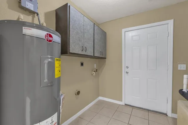 a view of an entryway with wooden cabinet