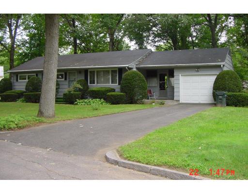 40 Winding Lane Springfield, MA 01118 - Photo 1 of 15 a front view of a house with a garden and yard