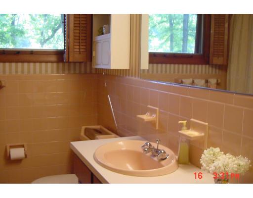 40 Winding Lane Springfield, MA 01118 - Photo 11 of 15 a bathroom with a sink a toilet and a mirror