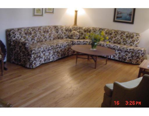 40 Winding Lane Springfield, MA 01118 - Photo 6 of 15 a living room with a couch and a table
