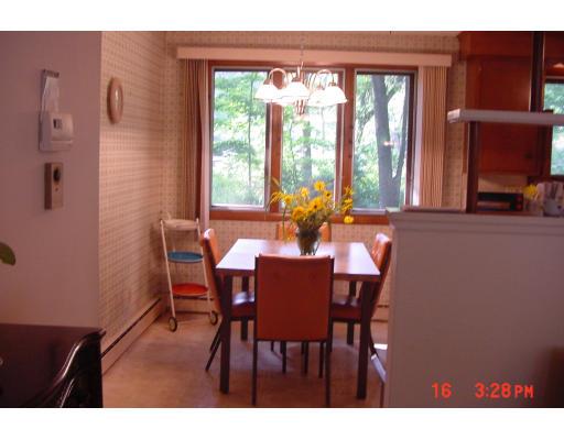 40 Winding Lane Springfield, MA 01118 - Photo 7 of 15 a view of a dining room with furniture and a window