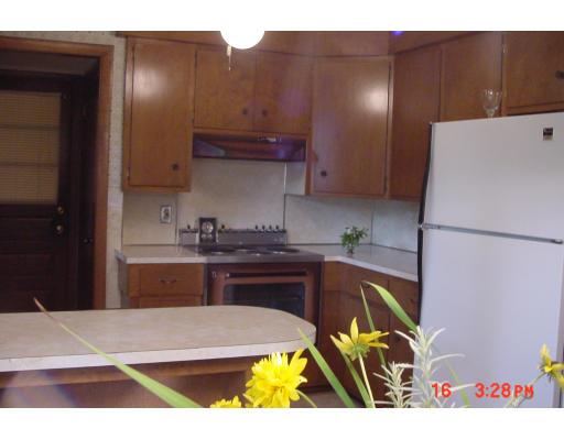 40 Winding Lane Springfield, MA 01118 - Photo 8 of 15 a kitchen with a sink appliances and cabinets