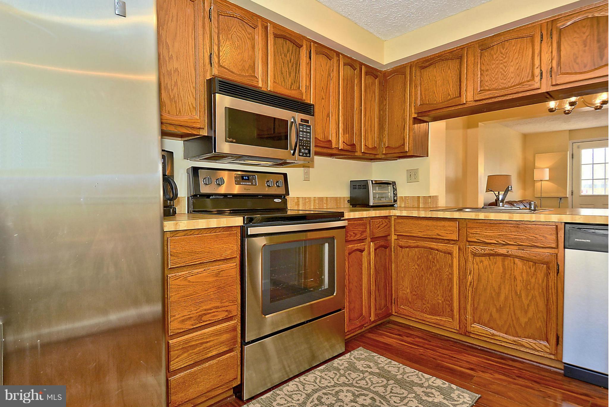 18 Cross Ridge Court Germantown, MD 20874 - Photo 6 of 30 Kitchen with passage to Dining Area
