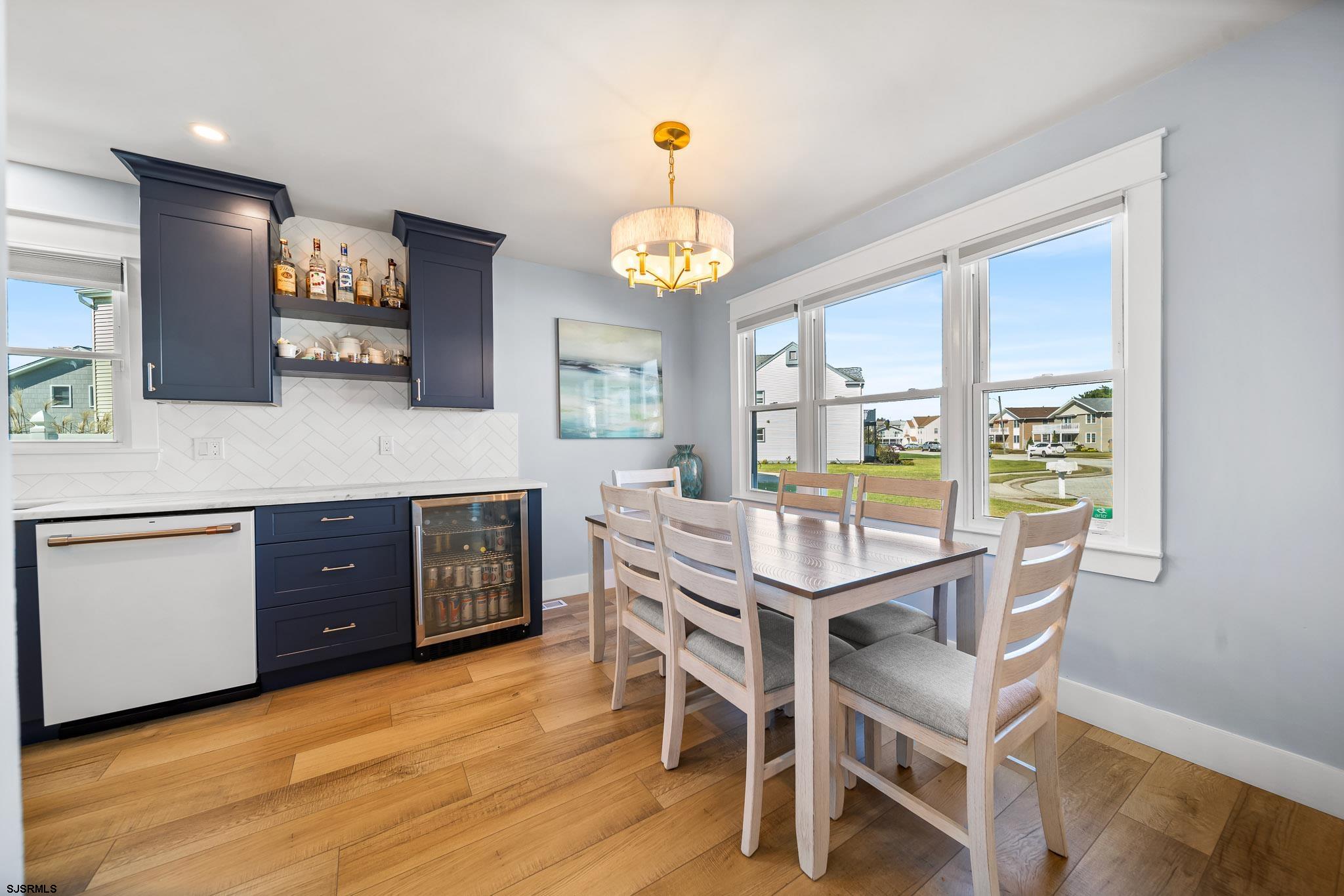 7 A Lighthouse Cove, Unit A Brigantine, NJ 08203 - Photo 11 of 31 a kitchen with a table and chairs in it