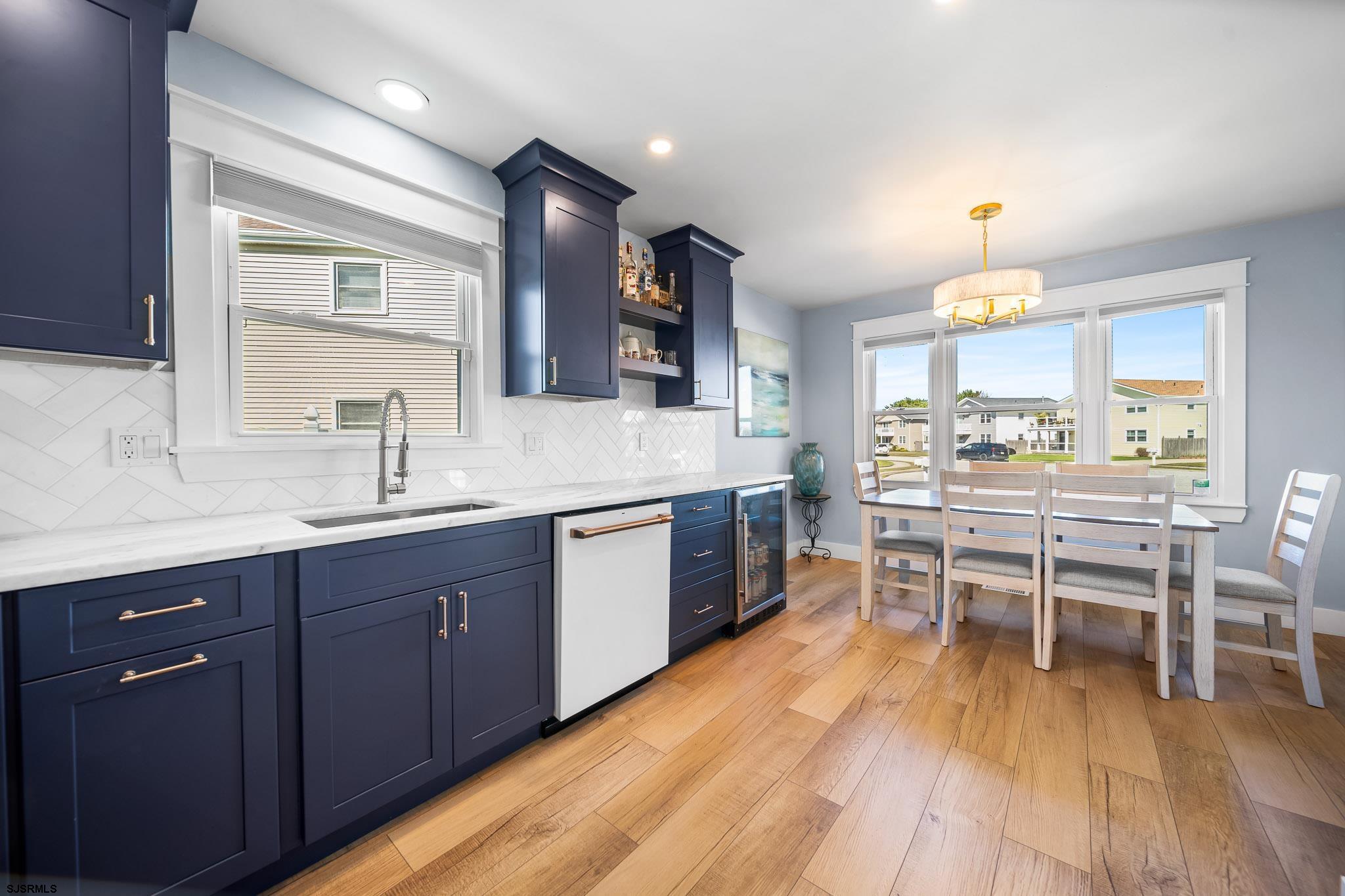 7 A Lighthouse Cove, Unit A Brigantine, NJ 08203 - Photo 14 of 31 a kitchen with a sink and wooden cabinets