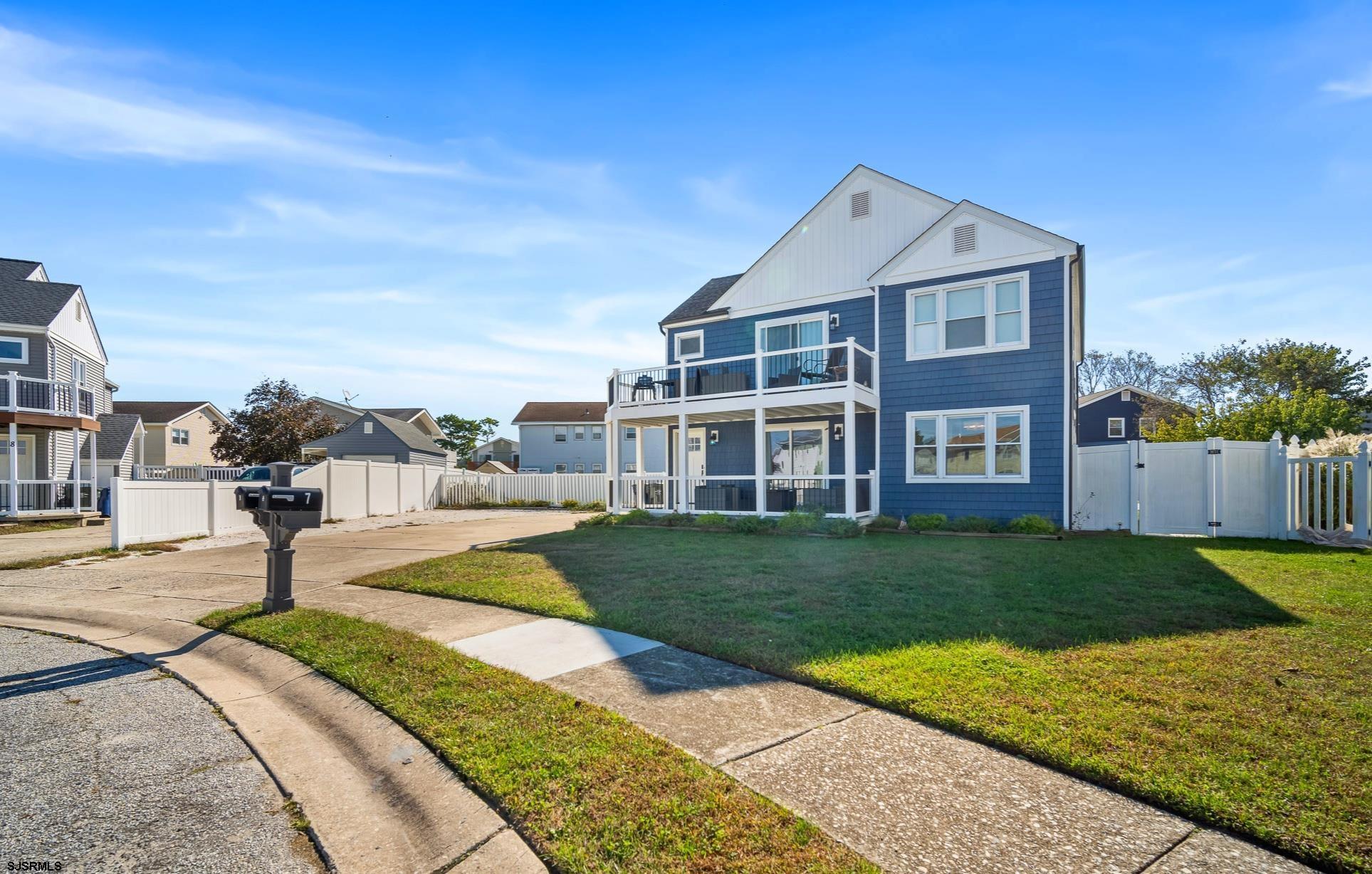7 A Lighthouse Cove, Unit A Brigantine, NJ 08203 - Photo 2 of 31 a front view of a house with garden