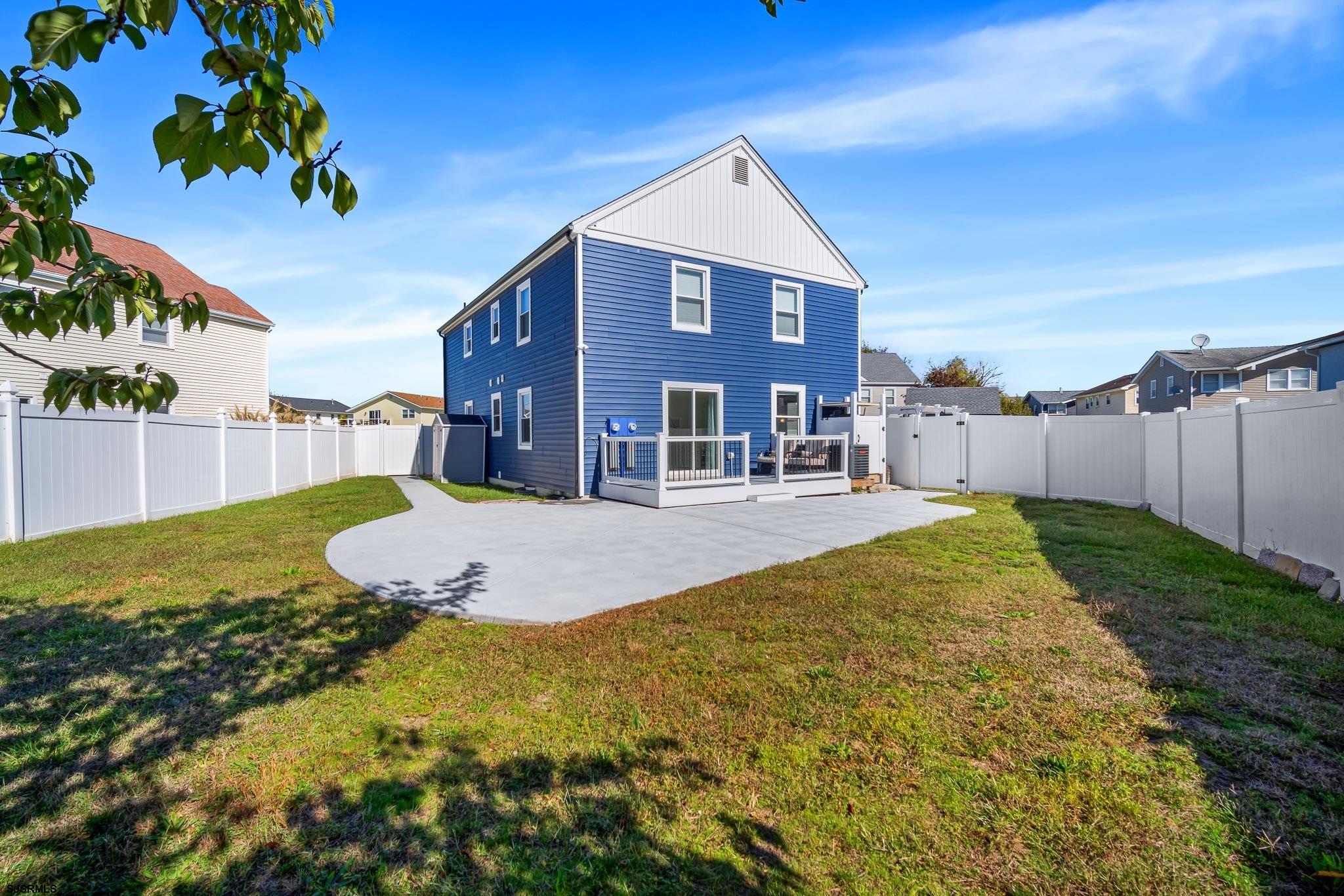 7 A Lighthouse Cove, Unit A Brigantine, NJ 08203 - Photo 25 of 31 a view of a house with a yard